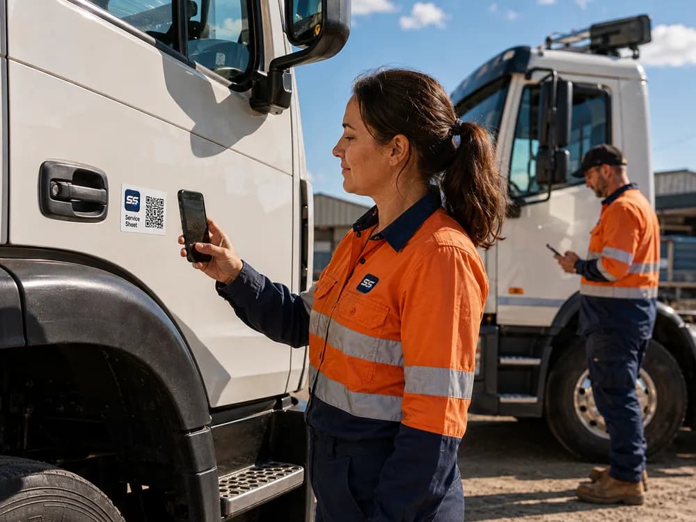 Illustrative scene of a driver scanning a Service Sheet QR label on a parked truck, with another driver using a phone nearby.